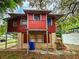 Back view of red house needing some repairs at 1414 7Th S St, St Petersburg, FL 33701