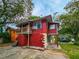 Another side view of the red house at 1414 7Th S St, St Petersburg, FL 33701