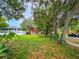 Home's lot has mature trees on a quiet street with ample green space at 1414 7Th S St, St Petersburg, FL 33701