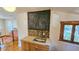 View of a kitchen area with stainless steel sink, window, and chalkboard, providing a practical and artistic touch at 1414 7Th S St, St Petersburg, FL 33701