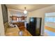 Charming kitchen with dark appliances, cabinetry, and hardwood floors, offering a blend of functionality and classic style at 1414 7Th S St, St Petersburg, FL 33701