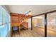 Open-concept living room with modern floors and a unique staircase at 1414 7Th S St, St Petersburg, FL 33701