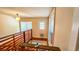 Upper landing with wooden floors, railings, and natural light, creating a warm and inviting transitional space at 1414 7Th S St, St Petersburg, FL 33701