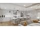Modern kitchen with white cabinets and large island at 14046 Gulf Blvd # 1, Madeira Beach, FL 33708