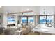 Living room with ocean view and modern fireplace at 14046 Gulf Blvd # 1, Madeira Beach, FL 33708