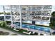 Luxury beachfront pool with lounge chairs and patio area at 14046 Gulf Blvd # 1, Madeira Beach, FL 33708