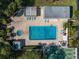 Aerial view of community pool, spa, and shuffleboard at 11485 Oakhurst Rd # 221, Largo, FL 33774