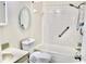 Bathroom with shower/tub combo and grab bars at 11485 Oakhurst Rd # 221, Largo, FL 33774