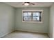 Spacious bedroom with ceiling fan and window at 11485 Oakhurst Rd # 221, Largo, FL 33774