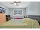 Main bedroom with a king-size bed and dresser at 11485 Oakhurst Rd # 221, Largo, FL 33774