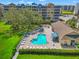 Community pool with a spa and lounge area at 960 Starkey Rd # 3406, Largo, FL 33771