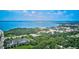 Aerial view of waterfront property, showcasing a large body of water and lush greenery at 3087, 3075 Cherry Ln, Clearwater, FL 33759