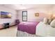 Bright bedroom with a TV and comfortable seating at 3087, 3075 Cherry Ln, Clearwater, FL 33759