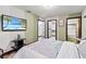 Bedroom with a queen-size bed and access to a closet at 3087, 3075 Cherry Ln, Clearwater, FL 33759