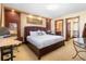 Spacious bedroom with a king-size bed and built-in workspace at 3087, 3075 Cherry Ln, Clearwater, FL 33759