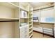 Walk-in closet with ample shelving and hanging space at 3087, 3075 Cherry Ln, Clearwater, FL 33759