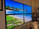 Beach-themed dining room with scenic wall screens at 3087, 3075 Cherry Ln, Clearwater, FL 33759