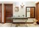 Elegant entryway with a console table and mirror at 3087, 3075 Cherry Ln, Clearwater, FL 33759