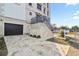 Modern home exterior featuring a stone facade and attached garage at 3087, 3075 Cherry Ln, Clearwater, FL 33759