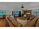 Large Gathering room with a leather sectional, hardwood floors, and a projector at 3087, 3075 Cherry Ln, Clearwater, FL 33759