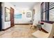 Bright hallway featuring tiled floors and stylish seating at 3087, 3075 Cherry Ln, Clearwater, FL 33759