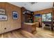 Modern home office with wood desk, built-ins and cork wall at 3087, 3075 Cherry Ln, Clearwater, FL 33759