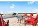 Rooftop patio with seating area, grill, and city views at 3087, 3075 Cherry Ln, Clearwater, FL 33759