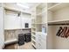 Large walk-in closet with ample shelving and hanging space at 3087, 3075 Cherry Ln, Clearwater, FL 33759