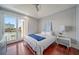 Bright bedroom with water views, featuring a comfortable bed and hardwood floors at 42 Midway Is, Clearwater, FL 33767