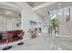 Bright and spacious entryway with a double staircase and wet bar at 42 Midway Is, Clearwater, FL 33767