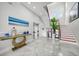 Elegant entryway with grand staircase and modern console table at 42 Midway Is, Clearwater, FL 33767