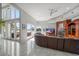 Spacious living room with water views, fireplace and curved sectional sofa at 42 Midway Is, Clearwater, FL 33767
