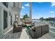 Waterfront patio with seating area and fire pit at 42 Midway Is, Clearwater, FL 33767