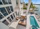 Relaxing pool and patio area with seating and fire pit at 42 Midway Is, Clearwater, FL 33767