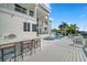 Outdoor kitchen, pool, and spacious deck for entertaining at 42 Midway Is, Clearwater, FL 33767
