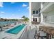 Enjoy the refreshing pool and spacious patio with outdoor seating at 42 Midway Is, Clearwater, FL 33767