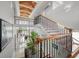 Grand staircase with metal railings and hardwood floors at 42 Midway Is, Clearwater, FL 33767