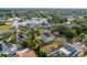 Wider aerial view of the house and neighborhood, highlighting the property's location at 553 Division St, Tarpon Springs, FL 34689