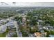 Wider aerial view showing the house and the surrounding neighborhood at 553 Division St, Tarpon Springs, FL 34689