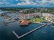 Scenic aerial view of a waterfront community with piers and a marina at 634 Edgewater Dr # 644, Dunedin, FL 34698