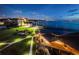 Dusk aerial view of a lit resort with pier and landscaping at 634 Edgewater Dr # 644, Dunedin, FL 34698