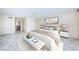 Bright bedroom featuring a ceiling fan, a large window, and marble flooring at 634 Edgewater Dr # 644, Dunedin, FL 34698