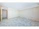 Spacious bedroom with marble floors, neutral paint, and a double closet at 634 Edgewater Dr # 644, Dunedin, FL 34698