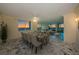 Bright dining room and living room features floor to ceiling windows and gorgeous marble floors at 634 Edgewater Dr # 644, Dunedin, FL 34698