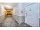 Well-maintained hallway with neutral tones leading to a unit door at 634 Edgewater Dr # 644, Dunedin, FL 34698