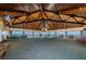A spacious meeting room with wood ceiling, carpeted floor, and panoramic water views at 634 Edgewater Dr # 644, Dunedin, FL 34698
