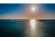 Serene shot of the ocean under a bright sun and expansive sky at 634 Edgewater Dr # 644, Dunedin, FL 34698