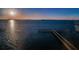 Scenic view of the pier stretching into the calm waters during sunset at 634 Edgewater Dr # 644, Dunedin, FL 34698