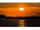Golden sunset on the horizon over the water at 634 Edgewater Dr # 644, Dunedin, FL 34698