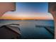 Beautiful water view with fishing piers under a colorful sunset at 634 Edgewater Dr # 644, Dunedin, FL 34698